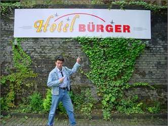 After my breakfast of deep fried salami and sauerkraut sandwiches, with my gut busting to spill out of my jeans, I manage to find time to pose in front of the sign for this well run establishment.